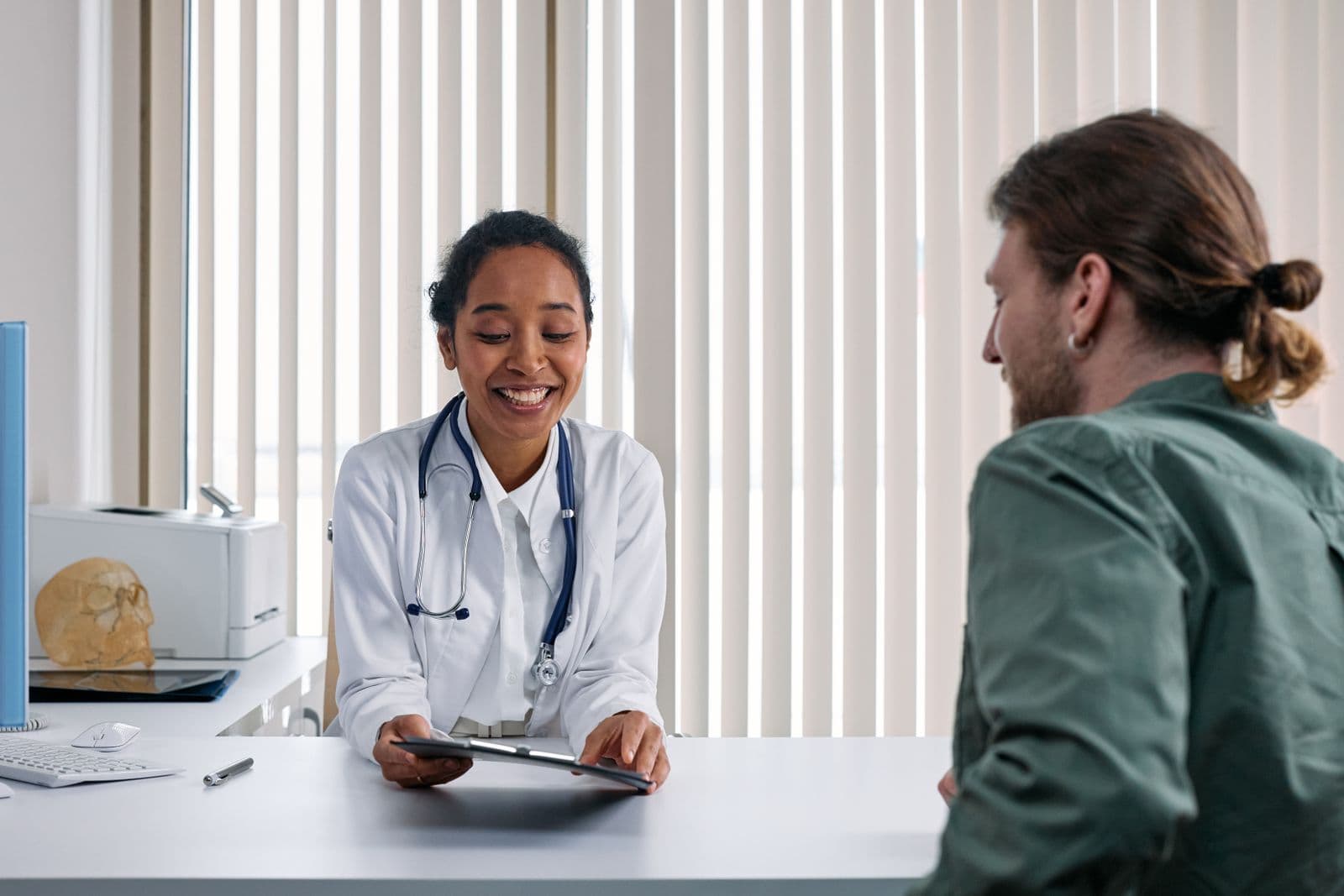 Doctor consults with a patient in a modern medical office